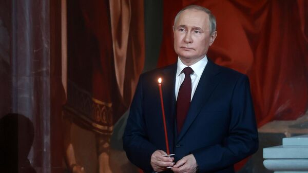 Russian President Vladimir Putin attending the midnight Easter service at the Cathedral of Christ the Savior in Moscow. April 24, 2022. - Sputnik भारत