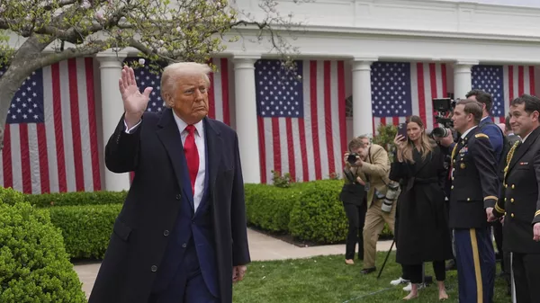 US President Donald Trump departs after signing an executive order at an event to announce new tariffs in the Rose Garden of the White House, Wednesday, April 2, 2025, in Washington. - Sputnik India