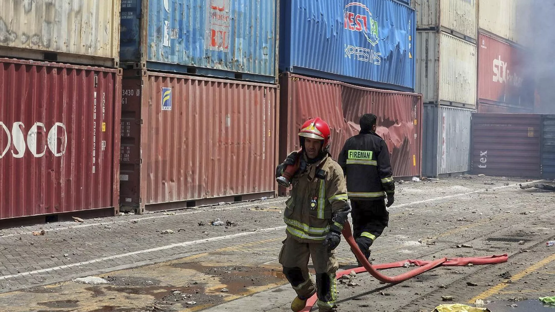 In this photo provided by the Iranian Red Crescent Society on Sunday, April 27, 2025, firefighters work after a massive explosion and fire rocked the Shahid Rajaei port near the southern port city of Bandar Abbas, Iran, on Saturday. (Iranian Red Crescent Society via AP)