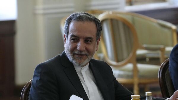 Iranian Foreign Minister Abbas Araghchi attends a meeting with Qatari Prime Minister and Foreign Minister Sheikh Mohammed bin Abdulrahman Al Thani in Tehran, Iran, Monday, Aug. 26, 2024. (AP Photo/Vahid Salemi) - Sputnik India