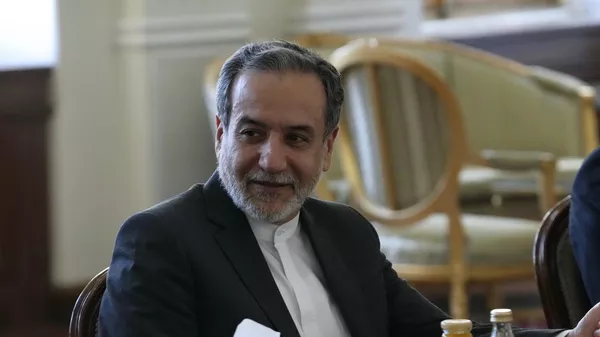 Iranian Foreign Minister Abbas Araghchi attends a meeting with Qatari Prime Minister and Foreign Minister Sheikh Mohammed bin Abdulrahman Al Thani in Tehran, Iran, Monday, Aug. 26, 2024. (AP Photo/Vahid Salemi) - Sputnik India