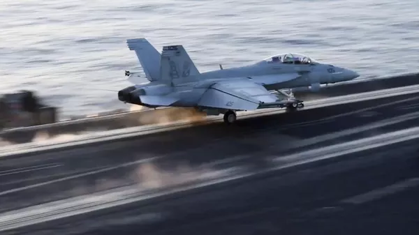 US Navy photo of fighter jet taking off from the USS Harry S. Truman aircraft carrier in the Red Sea to engage in strikes on Yemen. March 5, 2025. - Sputnik भारत