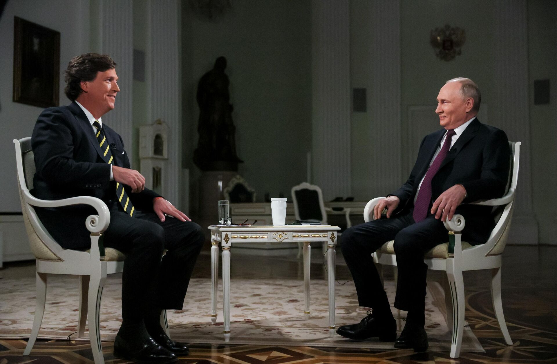 Russian President Vladimir Putin and US journalist Tucker Carlson. File photo - Sputnik भारत, 1920, 07.05.2025
