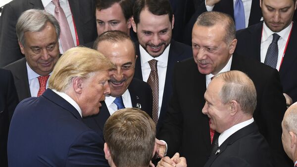 US President Donald Trump, left, shakes hands with Russian President Vladimir Putin, right, as Turkiye's President Recep Tayyip Erdogan, 2nd right and United Nations Secretary-General Antonio Guterres, left, look on, on the sidelines of the G-20 summit in Osaka, Japan, Saturday, June 29, 2019 - Sputnik भारत