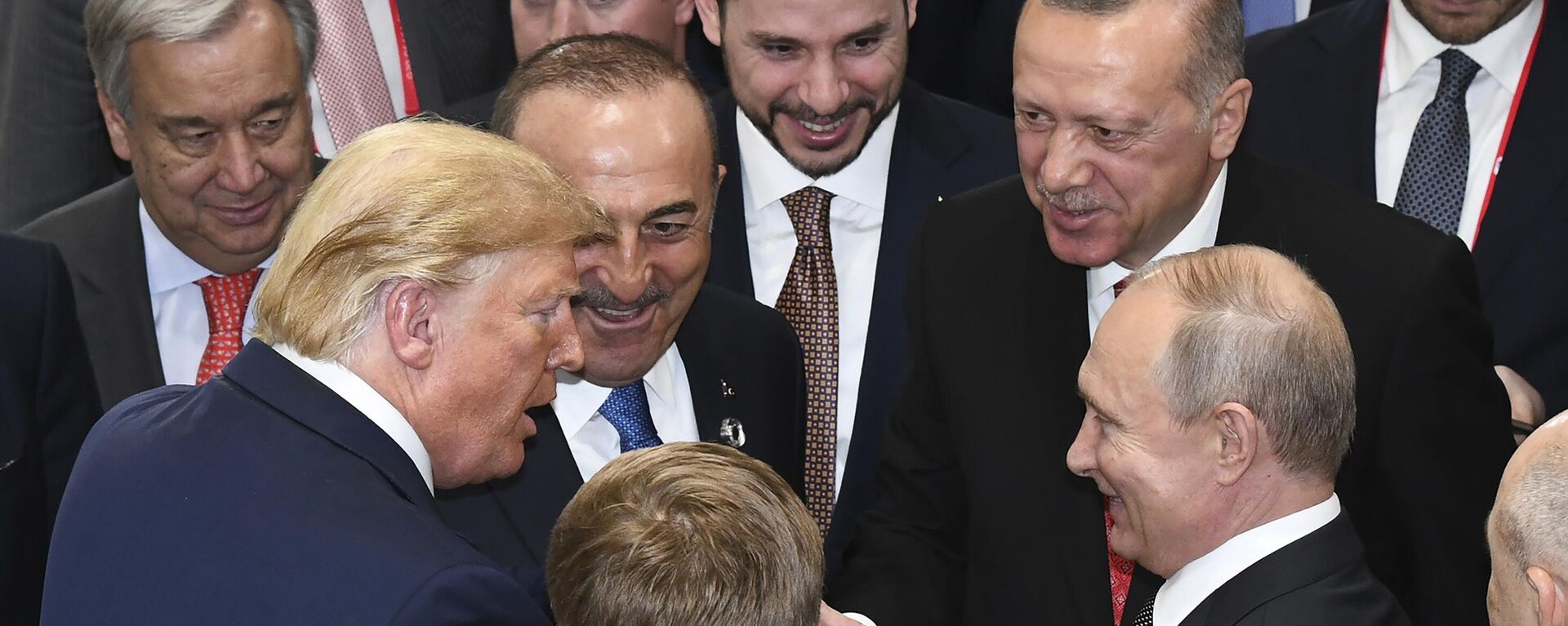 US President Donald Trump, left, shakes hands with Russian President Vladimir Putin, right, as Turkiye's President Recep Tayyip Erdogan, 2nd right and United Nations Secretary-General Antonio Guterres, left, look on, on the sidelines of the G-20 summit in Osaka, Japan, Saturday, June 29, 2019 - Sputnik भारत, 1920, 12.05.2025