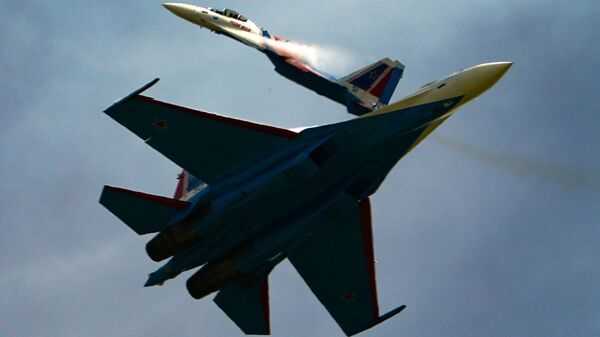 Su-35C jets of the Russian Knights aerobatic team perform a demonstration flight at the Army-2020 forum outside Moscow.  - Sputnik India