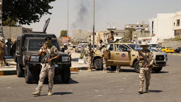 Libyan army forces and vehicles are stationed in a street in the country’s capital of Tripoli on Friday, July 22 2022 - Sputnik भारत