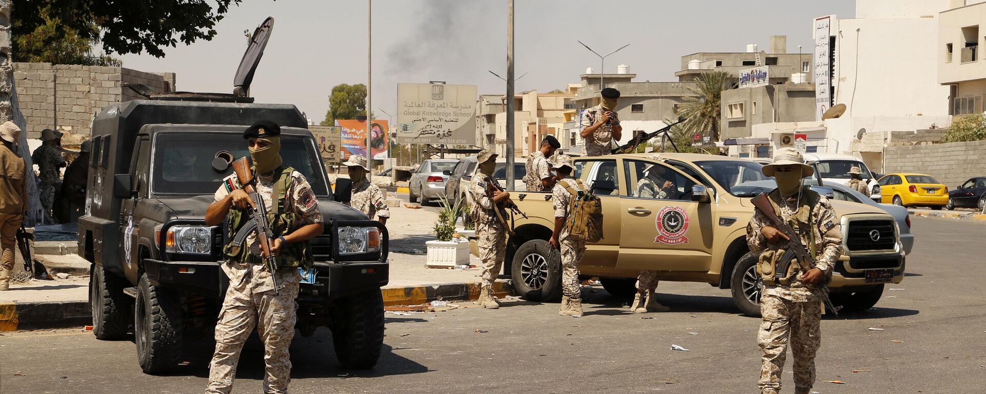 Libyan army forces and vehicles are stationed in a street in the country’s capital of Tripoli on Friday, July 22 2022 - Sputnik भारत, 1920, 13.05.2025