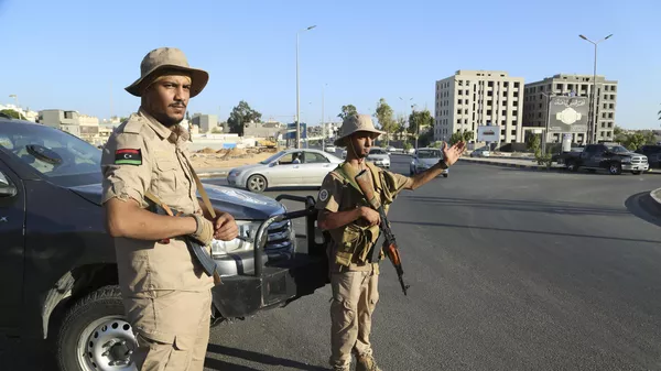 Libyan security forces stand guard in Tripoli, Libya, Tuesday, Aug. 16, 2023 - Sputnik भारत
