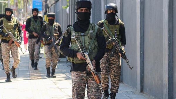 Indian paramilitary soldiers patrol along a street in Srinagar, Jammu and Kashmir, on May 12, 2025.  - Sputnik India