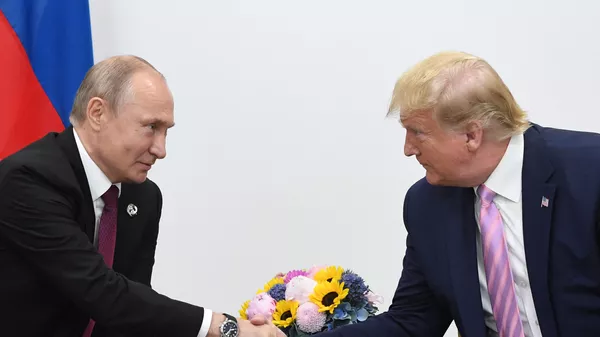 Russian President Vladimir Putin and U.S. President Donald Trump shake hands during a bilateral meeting at the at the Group of 20 (G20) leaders summit in Osaka, Japan. - Sputnik India