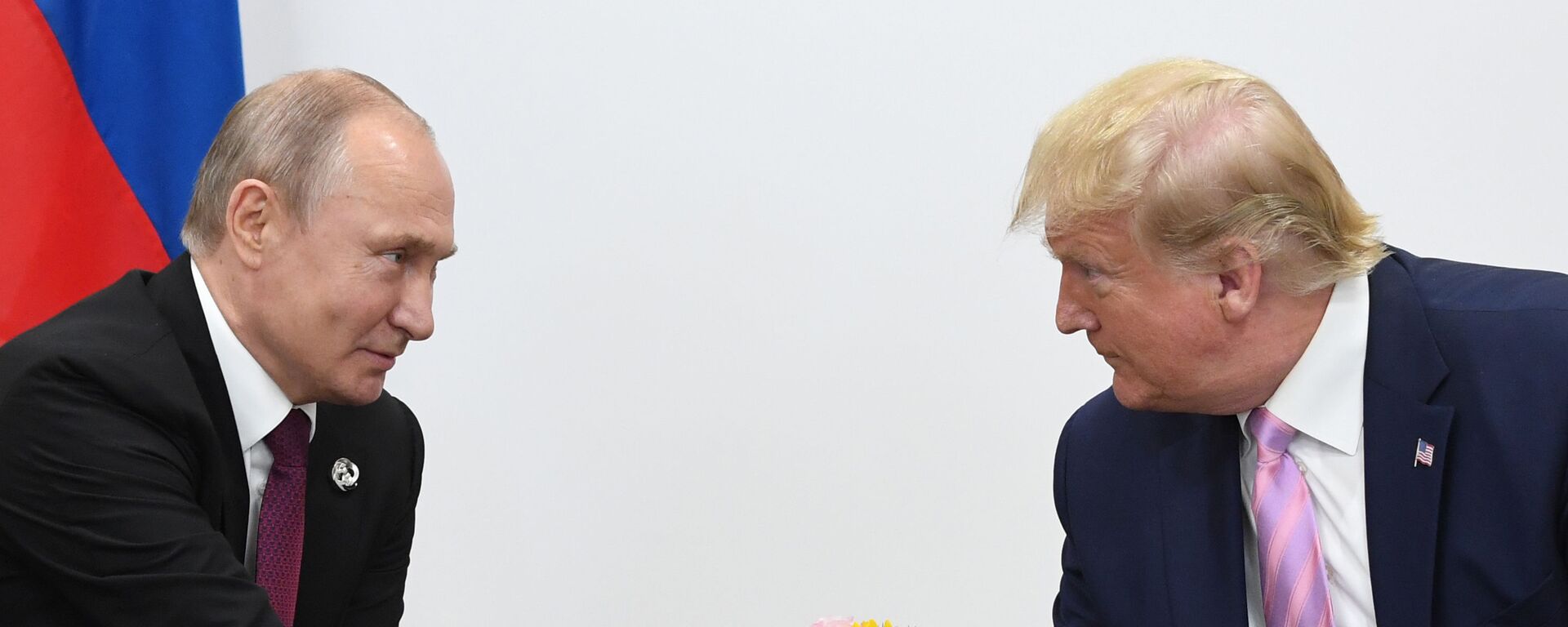 Russian President Vladimir Putin and U.S. President Donald Trump shake hands during a bilateral meeting at the at the Group of 20 (G20) leaders summit in Osaka, Japan. - Sputnik भारत, 1920, 09.08.2025