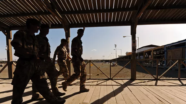 UK soldiers walk at a base in Kandahar on May 6, 2010. - Sputnik India