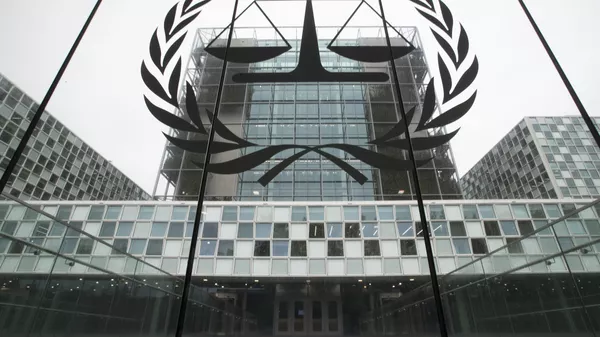 FILE- In this Nov. 7, 2019 file photo, the International Criminal Court, or ICC, is seen in The Hague, Netherlands. President Donald Trump has lobbed a broadside attack against the International Criminal Court. He's authorizing economic sanctions and travel restrictions against court workers directly involved in investigating American troops and intelligence officials for possible war crimes in Afghanistan without U.S. consent. The executive order Trump signed on Thursday marks his administration’s latest attack against international organizations, treaties and agreements that do not hew to its policies. (AP Photo/Peter Dejong, File) - Sputnik भारत