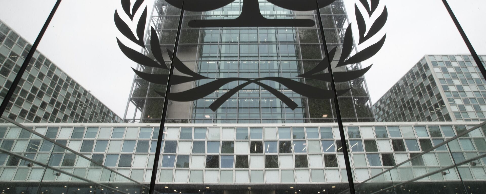 FILE- In this Nov. 7, 2019 file photo, the International Criminal Court, or ICC, is seen in The Hague, Netherlands. President Donald Trump has lobbed a broadside attack against the International Criminal Court. He's authorizing economic sanctions and travel restrictions against court workers directly involved in investigating American troops and intelligence officials for possible war crimes in Afghanistan without U.S. consent. The executive order Trump signed on Thursday marks his administration’s latest attack against international organizations, treaties and agreements that do not hew to its policies. (AP Photo/Peter Dejong, File) - Sputnik भारत, 1920, 30.05.2025
