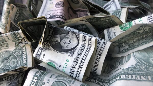 This Wednesday, April 3, 2019, file photo shows a box filled with dollar bills, in New York. - Sputnik India