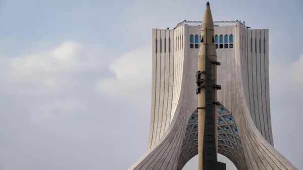 An Iran-made ballistic missile is displayed in front of the Azadi (Freedom) Monument during a rally commemorating the 46th anniversary of the victory of Iran's 1979 Islamic Revolution at Azadi Square in western Tehran, Iran, on February 10, 2025. The Iranian Islamic Revolution, which leads to the overthrow of the Pahlavi dynasty in 1979, replaces the Imperial State of Iran with the present-day Islamic Republic of Iran.  - Sputnik भारत