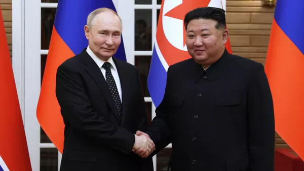 Russian President Vladimir Putin and North Korean leader Kim Jong Un pose for photos after a welcoming ceremony at Kumsusan state residence in Pyongyang, North Korea - Sputnik India