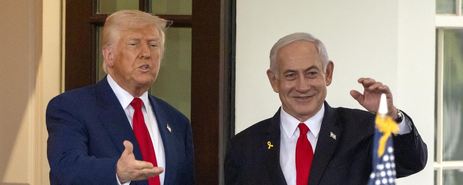President Donald Trump, left, and Israel's Prime Minister Benjamin Netanyahu wave as Netanyahu leaves the West Wing of the White House, Monday, April 7, 2025, in Washington.  - Sputnik India, 1920, 15.06.2025