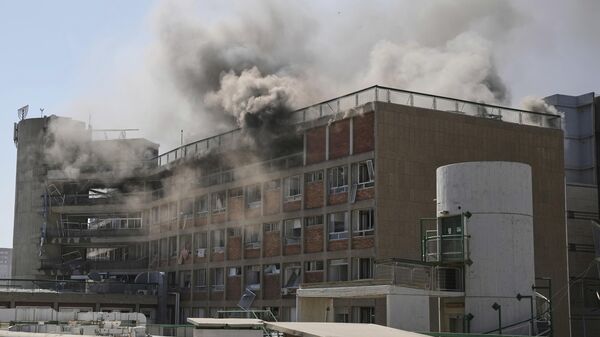 Smokes rises from a building of the Soroka hospital complex after it was hit by a missile fired from Iran in Beersheba, Israel. - Sputnik भारत