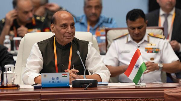 India's Defence Minister Rajnath Singh, left, attends the Defense Ministers' Meeting of the Shanghai Cooperation Organization Members States in Qingdao in eastern China's Shandong province on Thursday, June 26, 2025. - Sputnik India