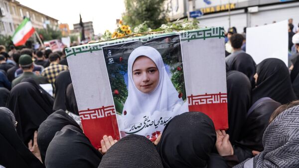 ASTANEH-YE ASHRAFIYEH, IRAN - 2025/06/26: Women are seen carrying a coffin of Mahya Sedighi Saber, the daughter of the Iranian nuclear scientist during the joint funeral for Iranian nuclear scientist Mohammad Reza Sedighi Saber and the 15 relatives and neighbors who were also killed alongside him in an Israeli rocket strike. Dozens attended the funeral of Mohammad Reza Sedighi Saber, an Iranian nuclear scientist, along with 15 of his family members and neighbors killed in an Israeli rocket strike. After surviving a failed assassination attempt in Tehran, Saber had moved to his parents' home in Astaneh Ashrafieh, Gilan Province, where the fatal second attack occurred. Israel has reportedly carried out multiple coordinated strikes across Iran targeting scientists, aiming to disrupt the country's nuclear and missile programs. (Photo by Alborz Irani/SOPA Images/LightRocket via Getty Images) - Sputnik India