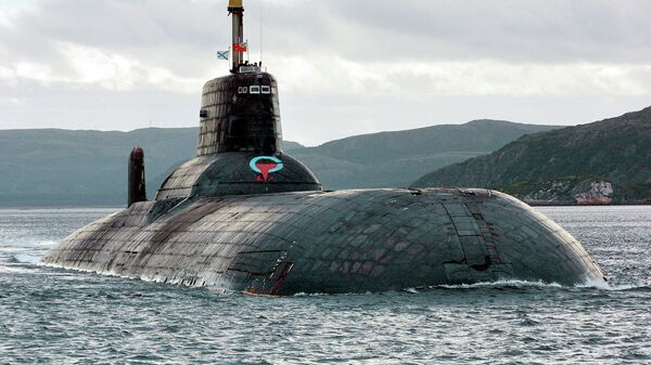 One of Russia's largest Soviet-built nuclear submarines, Typhoon (Akula) class, which remains the world's largest with the displacement of about 25,000 metric tons (27,500 tons) heaves ahead in the Barents Sea at Russia's Arctic Coast in this September 2001 photo - Sputnik India