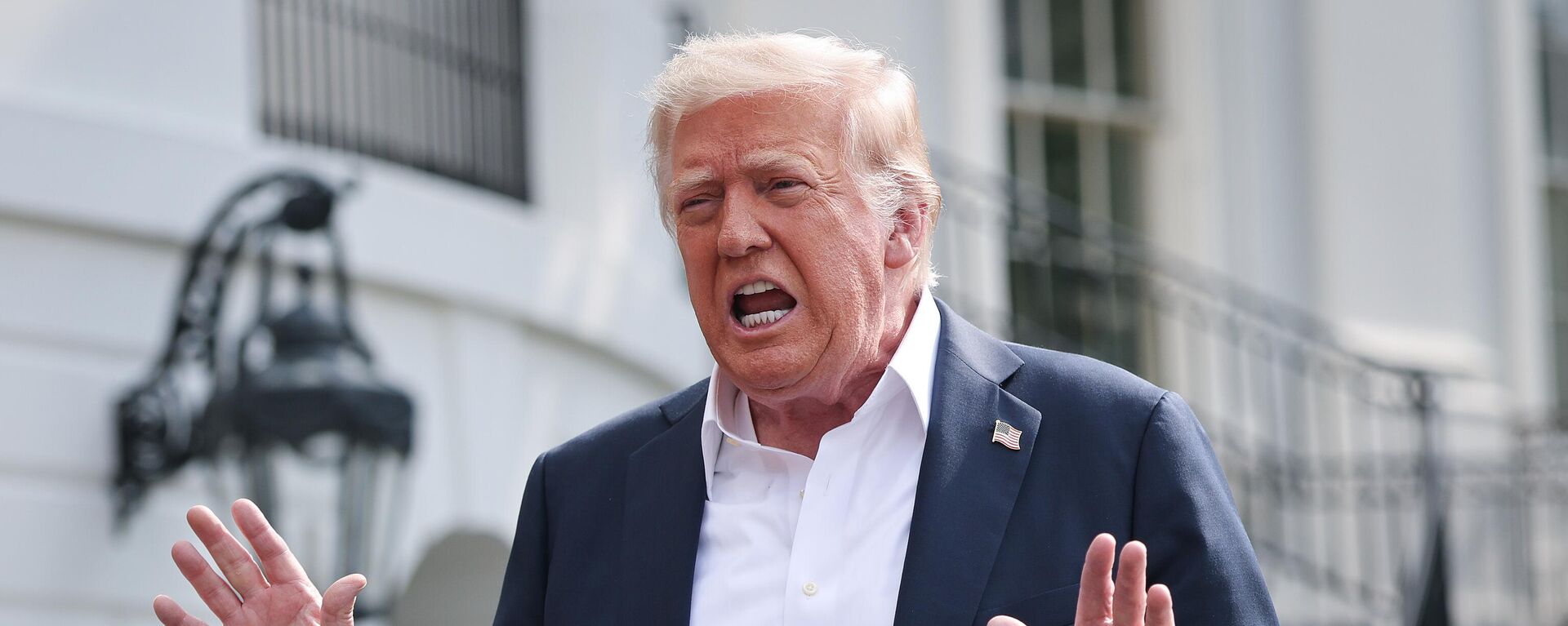WASHINGTON, DC - JULY 11: U.S. President Donald Trump answers questions while departing the White House on July 11, 2025 in Washington, DC. Trump is scheduled to travel to Central Texas today to meet with first responders and local elected officials involved with the recovery process from last week's flash flooding event that has claimed more than 120 lives.  (Photo by Win McNamee/Getty Images) - Sputnik India, 1920, 14.07.2025