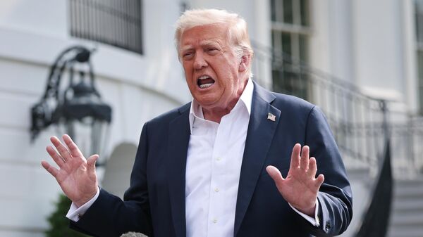 WASHINGTON, DC - JULY 11: U.S. President Donald Trump answers questions while departing the White House on July 11, 2025 in Washington, DC. Trump is scheduled to travel to Central Texas today to meet with first responders and local elected officials involved with the recovery process from last week's flash flooding event that has claimed more than 120 lives.  (Photo by Win McNamee/Getty Images) - Sputnik India
