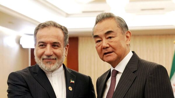 Iran's Foreign Minister Abbas Araghchi and China's Foreign Minister Wang Yi - Sputnik India