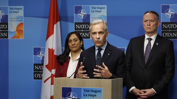 Canada's Prime Minister Mark Carney speaks during a media conference at the NATO summit in The Hague, Netherlands, Wednesday, June 25, 2025 - Sputnik भारत