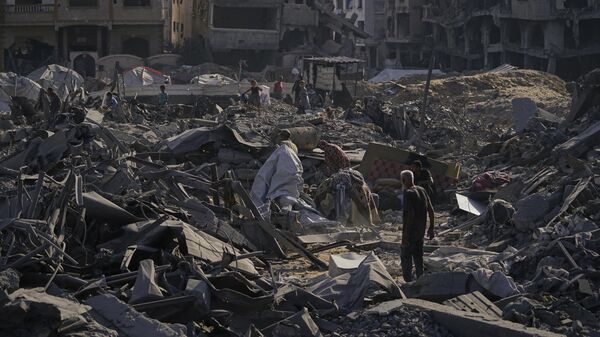 People inspect the damage at the Sheikh Radwan al-Taba UNRWA clinic following an Israeli army bombardment in Gaza City Wednesday, Aug. 6, 2025 - Sputnik India