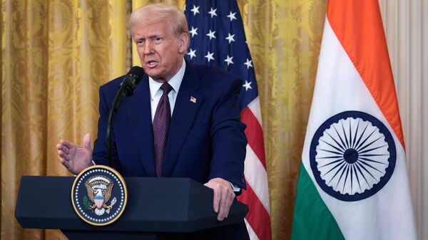 U.S. President Donald Trump holds a joint press conference with Indian Prime Minister Narendra Modi in the East Room at the White House on February 13, 2025 in Washington, DC. - Sputnik भारत