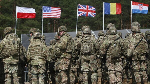 US troops, part of a NATO mission to enhance Poland's defence, are getting ready for an official welcoming ceremony in Orzysz, northeastern Poland, Thursday, April 13, 2017 - Sputnik भारत