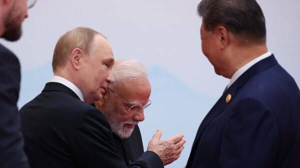 September 1, 2025. Russian President Vladimir Putin, Indian Prime Minister Narendra Modi and President of the People's Republic of China Xi Jinping (from left to right) at the ceremony of the official meeting between President of the People's Republic of China Xi Jinping and the heads of delegations participating in the meeting of the Council of Heads of State of the Shanghai Cooperation Organization (SCO) in Tianjin. - Sputnik India