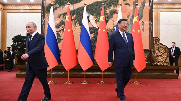 Russian President Vladimir Putin and President of the People's Republic of China Xi Jinping before the start of Russian-Chinese talks in Beijing. - Sputnik India
