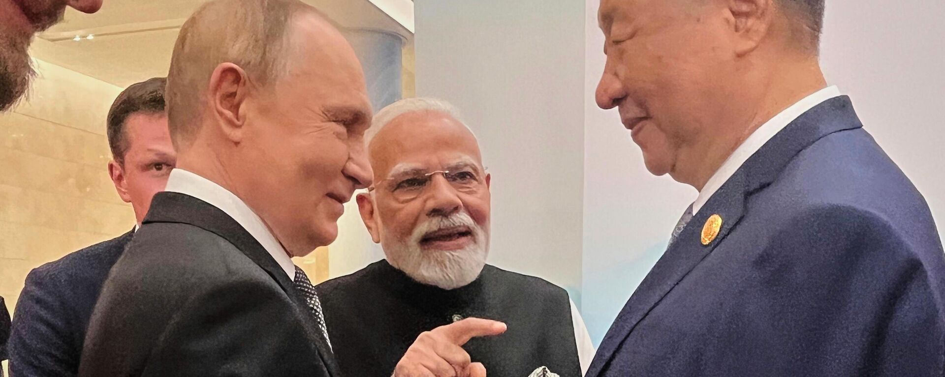 Russian President Vladimir Putin, from left, Indian Prime Minister Narendra Modi and Chinese President Xi Jinping talk ahead of the Shanghai Cooperation Organization (SCO) summit at the Meijiang Convention and Exhibition Center in Tianjin, China, Monday, Sept. 1, 2025. (Indian Prime Minister's Office via AP) - Sputnik India, 1920, 02.09.2025