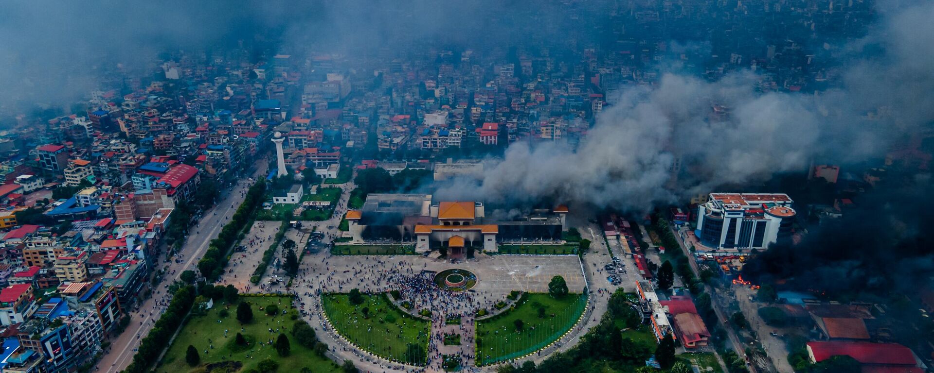 The aerial view shows demonstrators setting fires at public buildings in many places, including the Parliament building, across the Kathmandu, Lalitpur, and Bhaktapur districts in Nepal, on September 09, 2025.  - Sputnik भारत, 1920, 10.09.2025