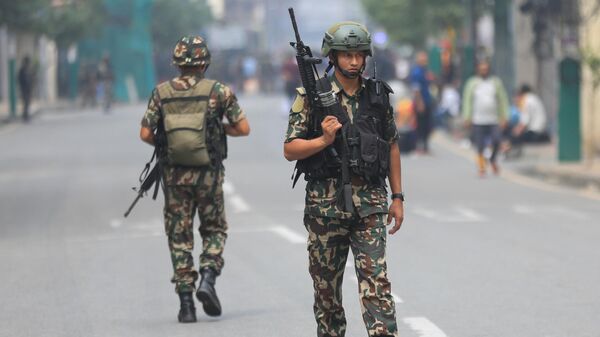 Nepalese Army patrols the streets in Kathmandu, Nepal, 10 September 2025, following violent demonstrations that destroyed major government buildings, including the Parliament and the government secretariat, Singha Durbar. - Sputnik भारत
