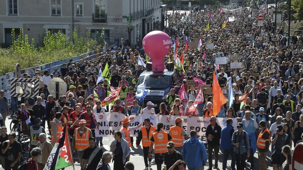 Demonstrators march during a protest called by major trade unions to oppose budget cuts, in Nantes, western France, Thursday, Sept. 18, 2025. - Sputnik India