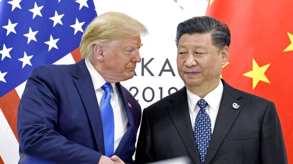 US President Donald Trump, left, shakes hands with China's President Xi Jinping during a meeting on the sidelines of the G-20 summit in Osaka, Japan, June 29, 2019. - Sputnik India