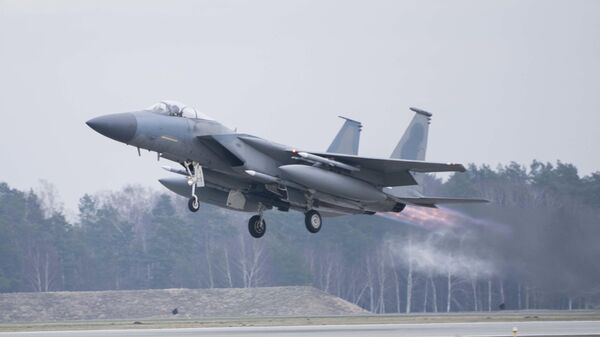 In this image provided by the US Air Force, a US Air Force F-15C Eagle assigned to the 493rd Fighter Squadron, Royal Air Force (RAF) Lakenheath, takes off in support of North Atlantic Treaty Organization enhanced air policing missions with the Polish Air Force at Lask Air Base, Poland, Feb. 15, 2022 - Sputnik भारत