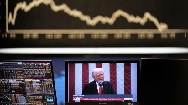 US President Donald Trump appears on a television screen at the stock market in Frankfurt, Germany, Thursday, April 3, 2025.  - Sputnik भारत