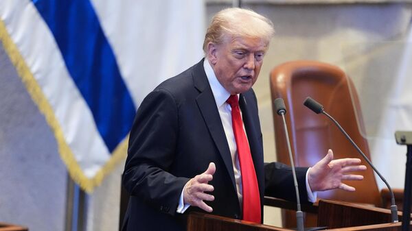 President Donald Trump speaks to the Knesset, Israel's parliament, Monday, Oct. 13, 2025, in Jerusalem. (AP Photo/Evan Vucci, Pool) - Sputnik India