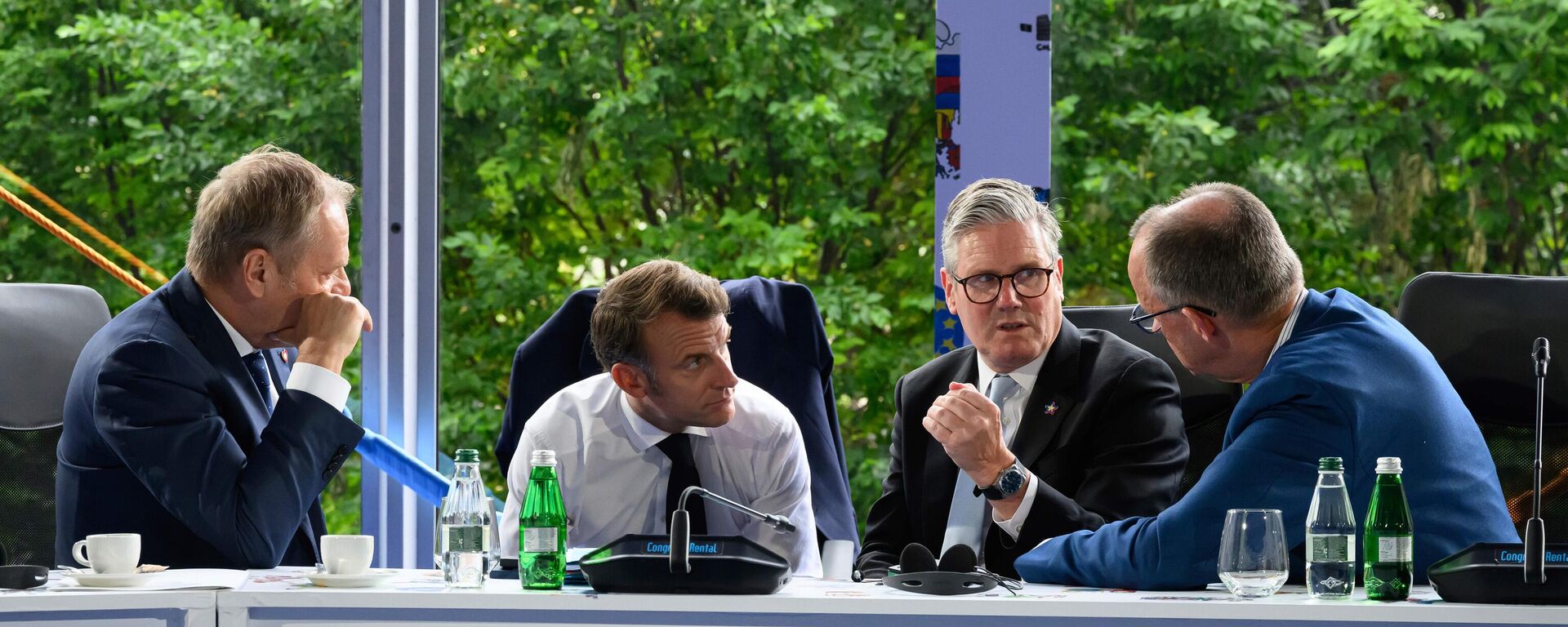 From left, Poland's Prime Minister Donald Tusk, France's President Emmanuel Macron, Britain's Prime Minister Keir Starmer and Germany's Chancellor Friedrich Merz speak during the Ukraine security meeting at the 6th European Political Community summit Friday May 16, 2025 in Tirana, Albania. (Leon Neal/Pool via AP) - Sputnik भारत, 1920, 27.02.2026