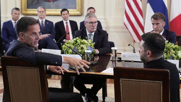 NATO Secretary General Mark Rutte, foreground left, speaks as Ukrainian President Volodymyr Zelenskyy, foreground right, British Prime Minister Keir Starmer, center left, and France's President Emmanuel Macron, center right - Sputnik India