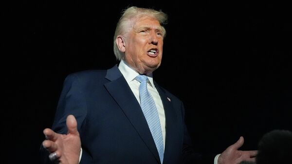 President Donald Trump speaks to reporters before boarding Air Force One at Palm Beach International Airport in West Palm Beach Fla., on his way back to the White House, Sunday, Nov. 16, 2025 - Sputnik India