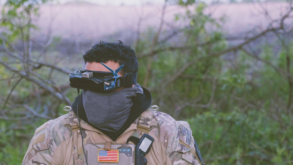 raoulduke_69 shares a picture on social media of a mercenary in Ukraine with an American flag, geotagged to Chasov Yar, April, 2024, The tattoos match those seen on Forward Observation Group's founder Derrick Bales. Published under fair use. - Sputnik भारत