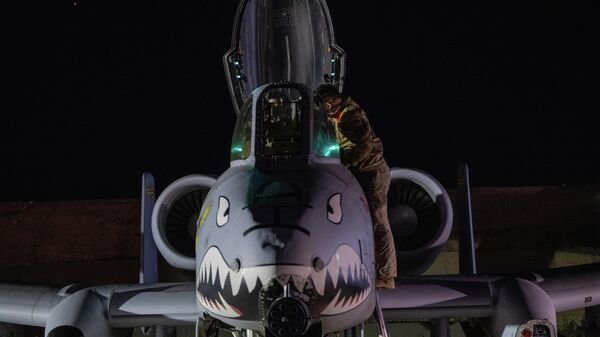 This photo provided by the US Air Force shows a US Airman preparing an A-10 Thunderbolt II for flight from a base in the US Central Command area of responsibility, Friday, Dec. 19, 2025, in support of Operation Hawkeye Strike - Sputnik India