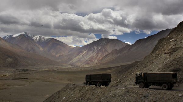FILE- In this Sept. 14, 2017, file photo, Indian army trucks drive near Pangong Tso lake near the India China border in India's Ladakh area. The Indian army said Saturday, Jan. 9, 2020, that it has apprehended a Chinese soldier in the remote Ladakh region, where the two countries are locked in a monthslong military standoff along their disputed mountain border. An army statement said the Chinese soldier was taken into custody on Friday for transgressing into the Indian side in area South of Pangong Tso lake. (AP Photo/Manish Swarup) - Sputnik India